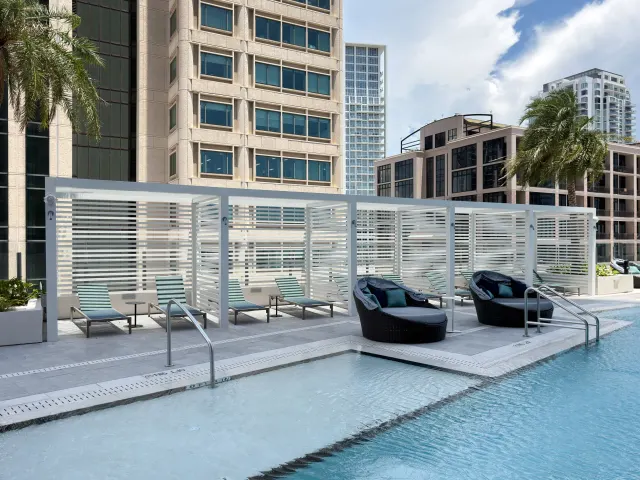 Louvered pool cabanas by Poma on the Art House amenity deck.