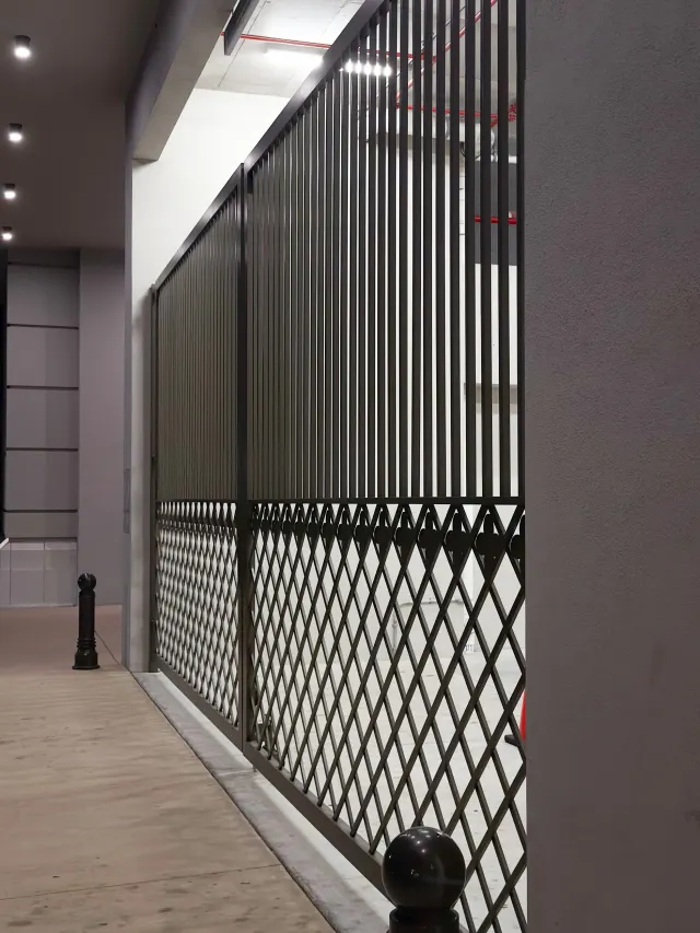 Diamond-lattice screen panels at the Hyde Park House garage level.