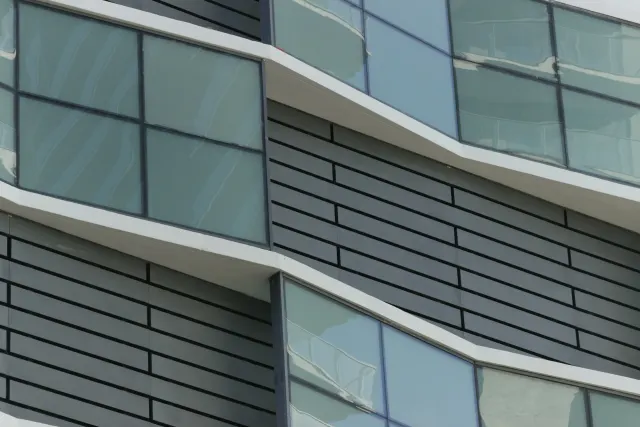 Detail of custom aluminum painted facade panels by Poma.