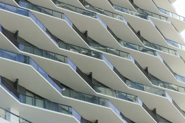 Detail of the custom concrete and glass balcony by Poma.