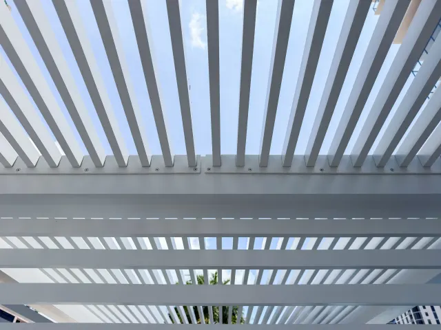 Louvered overhead of an Art House pool cabana.