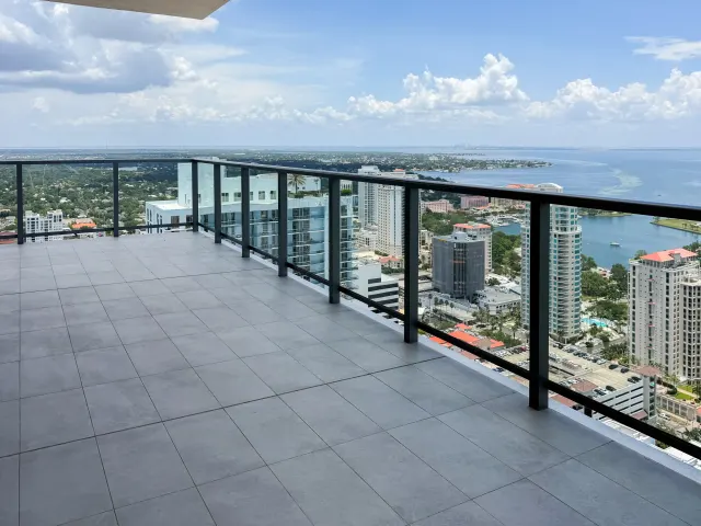 Glass balcony railing overlooking St. Petersburg and Tampa Bay at Art House.