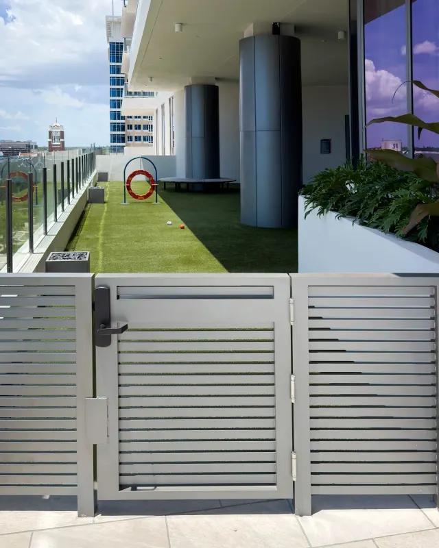 Horizontal-slat privacy gate and fence on the Art House amenity deck.