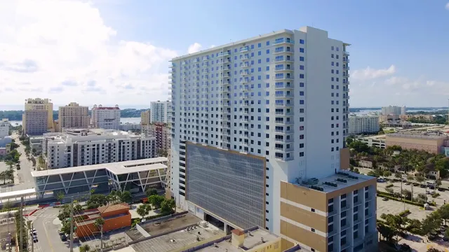 Park-Line Palm Beaches on Rosemary Avenue, with its perforated metal garage facade by Poma.